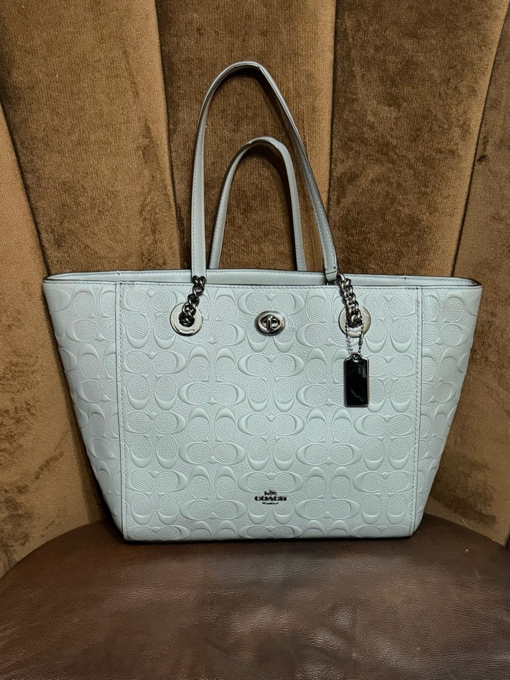 Coach Grey Signature Embossed
Leather Turnlock Chain Tote
Handbag